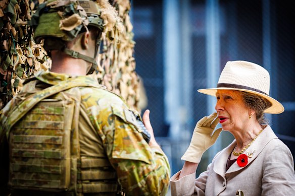Princess Anne speaks with soldiers at the Gallipoli Barracks on Remembrance Day.