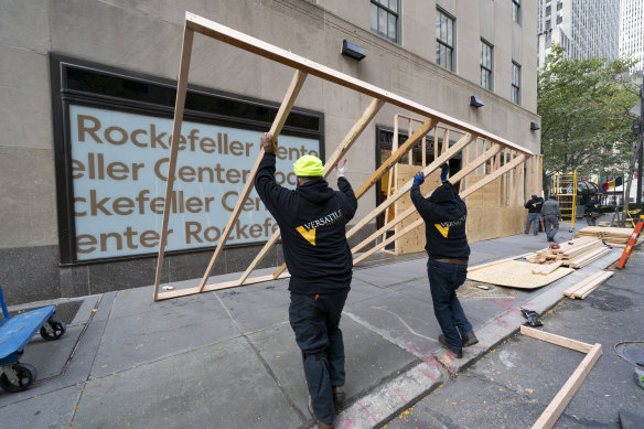 Workers erect barricades around the Rockefeller Centre in Manhattan.