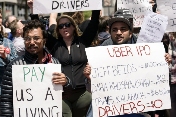 People protest low wages outside Uber’s headquarters in San Francisco in 2019.