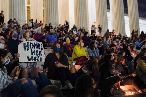 People gather at the US Supreme Court in Washington after the announcement of the death of Supreme Court Justice Ruth Bader Ginsburg.