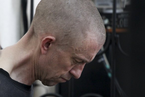 British citizen Shaun Pinner sits behind bars in a Donetsk courtroom.