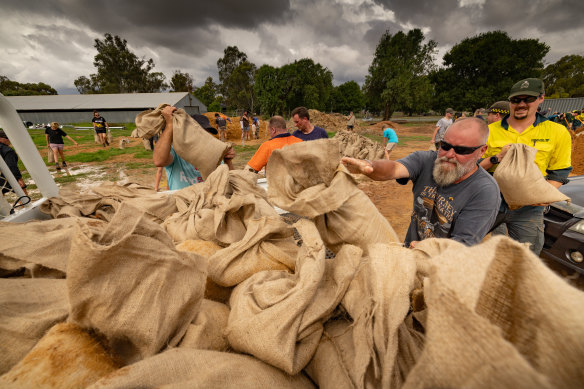 Residents in Rochester brace for more flooding, as people prepare to sandbag.