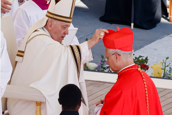 In 2023, newly elected Cardinal Robert Francis Prevost received his biretta from Pope Francis at the Vatican.