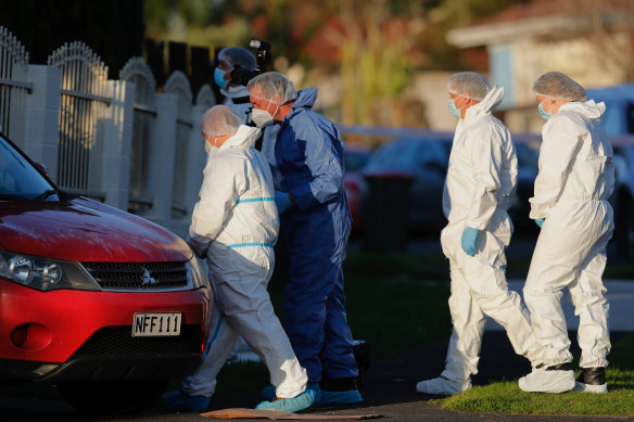 New Zealand police investigators at a scene in Auckland where two bodies were discovered in suitcases in August.