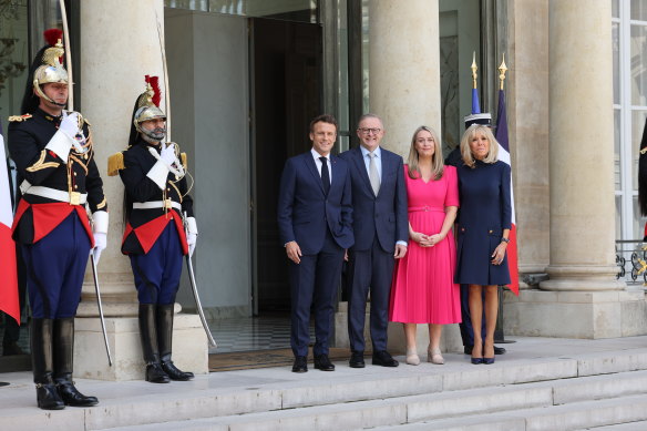 French President Emmanuel Macron (left) and his wife, Brigitte Macron (right), greet Australian Prime Minister Anthony Albanese and his partner Jodie Haydon at the Elysee Palace in Paris on Friday.