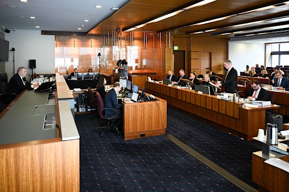 Commissioner Stuart Wood listens to senior counsel assisting Patrick Wheelahan.