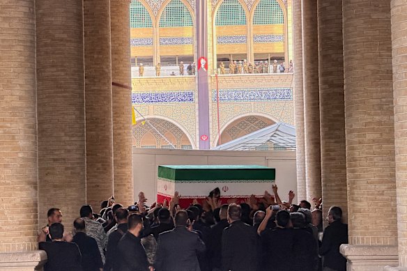 Khamenei’s casket is carried into the Grand Mosalla.