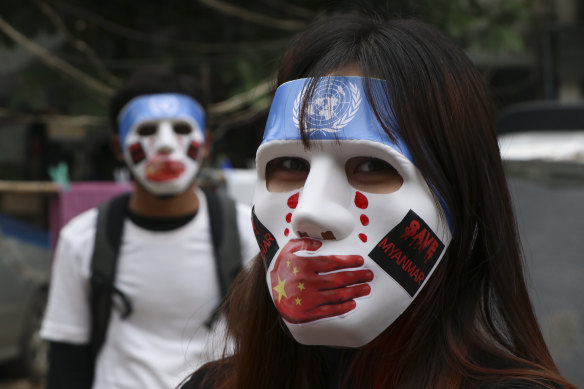 Young demonstrators participate in an anti-coup mask strike in Yangon, Myanmar. 