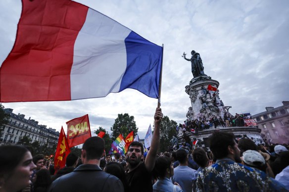 People gather at the Republique Plaza following the second round of French legislative elections.