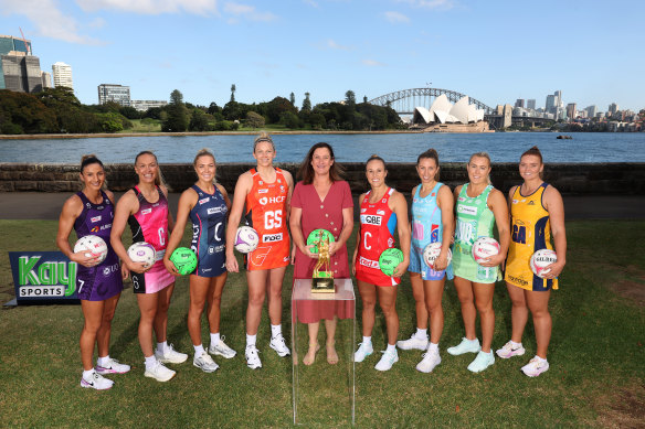 West (centre) with players from each of the Super Netball teams.