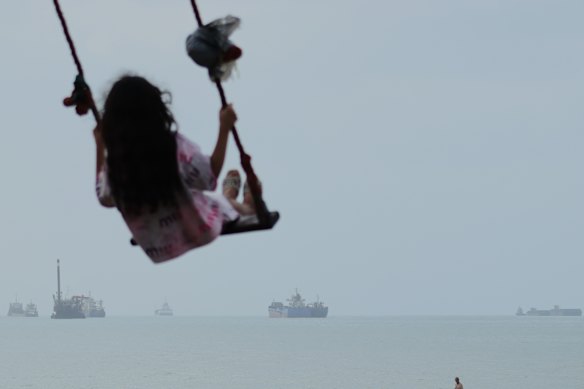 Cargo ships and other commercial vessels anchored in the Strait of Hormuz off Bandar Abbas, Iran, last week.