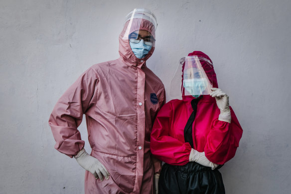 Drs Yohanes Ridora, left, and Nabila Kirtti pose during a virtual fashion show of personal protective equipment (PPE) in Yogyakarta, Indonesia. The fashion show was held as a form of gratitude for medical personnel.