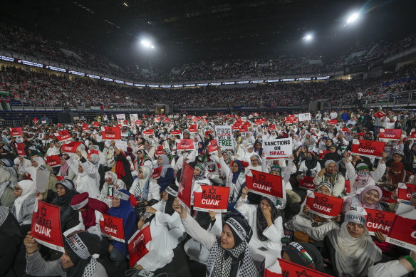 Malaysians turn out in their thousands to hear Prime Minister Anwar Ibrahim speak at the Axiata Arena in Kuala Lumpur.
