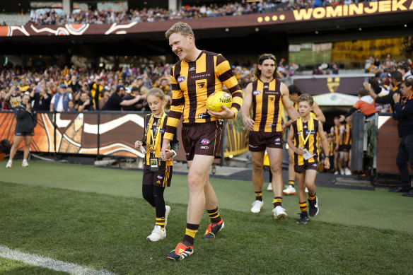 James Sicily leads out the Hawks.