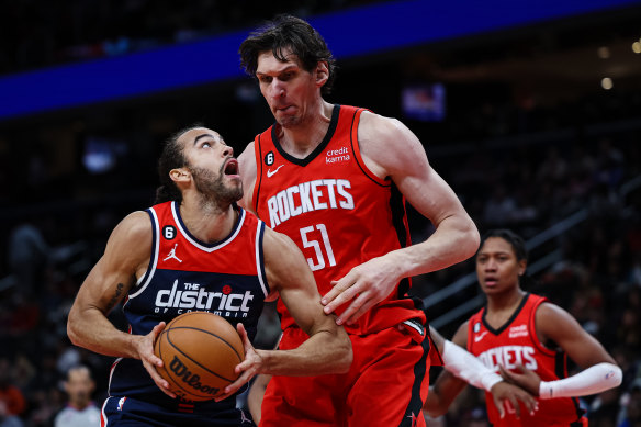 Xavier Cooks  takes on Boban Marjanovic of the Houston Rockets.