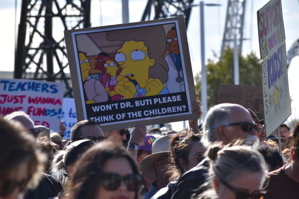 Another sign at the rally called on Education Minister Tony Buti to “think of the children”.