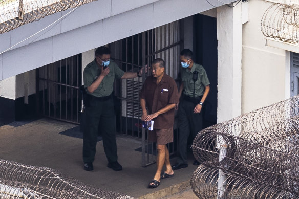 Jimmy Lai walks through the Stanley prison in Hong Kong, in July.