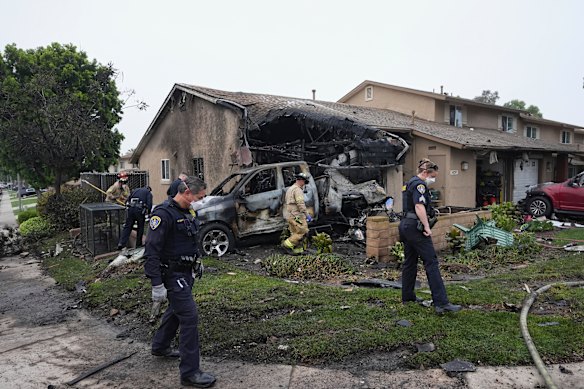 Authorities working at the scene of the crash.