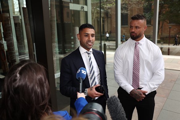 Tremaine Fernandez speaks to media outside the NSW Supreme Court next to ex-NRL player Sandor Earl.