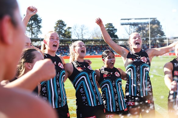 Port Adelaide celebrate their close win over GWS.