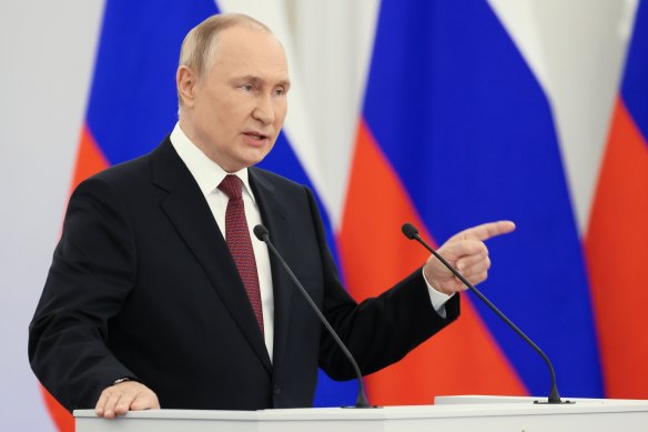 Russian President Vladimir Putin gestures during a ceremony to sign the treaties for four regions of Ukraine to join Russia.