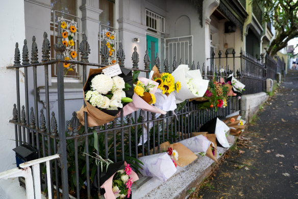Flowers were laid outside the Paddington home on Sunday morning.