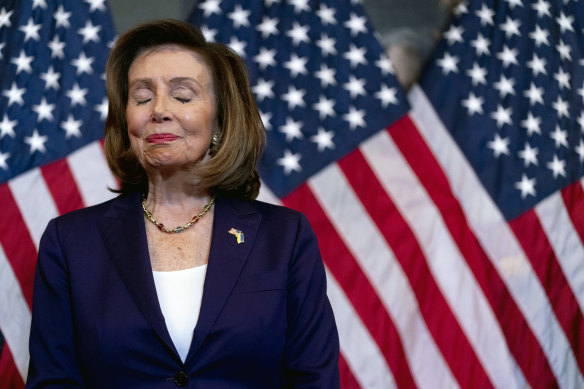 House Speaker Nancy Pelosi  appears to be emotional before signing the bill.