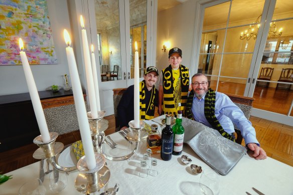 Orthodox Jewish Richmond supporters David Werdiger (right) with sons Ari, 25, and Rafi, 11, are ready to go into grand final "lockdown" at their home in Caulfield North. 