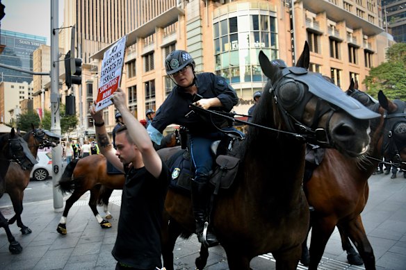Mounted police officers attempted to disperse the crowd.