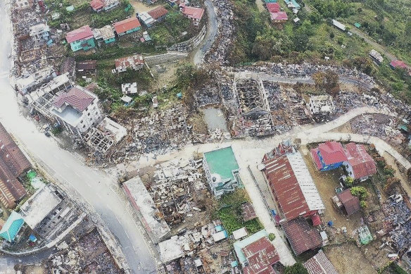 Buildings destroyed by fire fill the town of Thantlang in Chin state, Myanmar, last December.