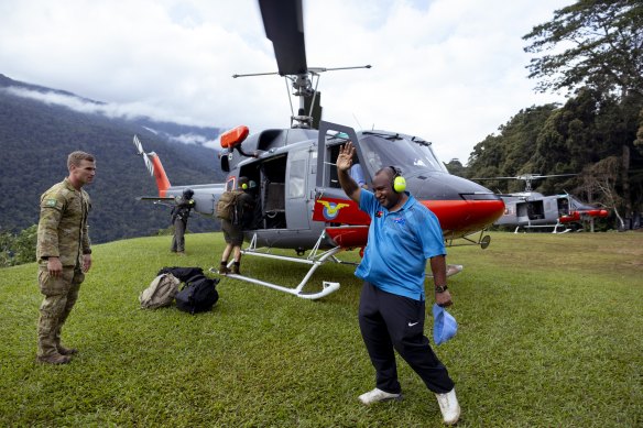 PNG Prime Minister James Marape waves as he and Albanese leave the Kokoda Track.