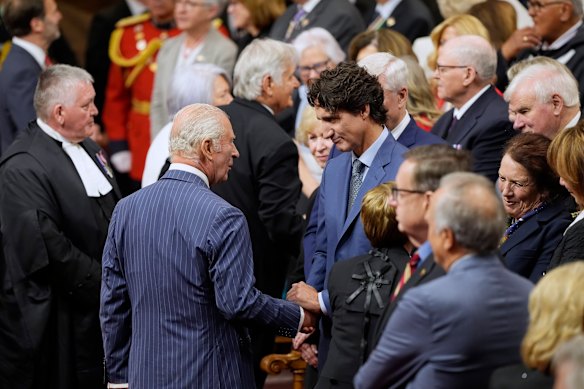 Former Canadian prime minister Justin Trudeau greets King Charles ahead of the speech.