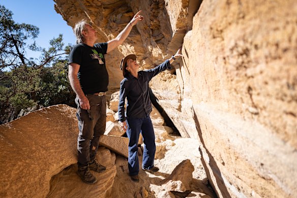 Cave art expert Wayne Brennan and  Dr Amy Mosig Way at a previously undocumented rock shelter showing signs of tool-making.
