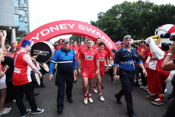 Tom Papley of the Swans and team mates march to ground