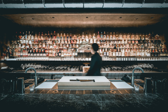 The well-stocked back bar at Bar Sumi.