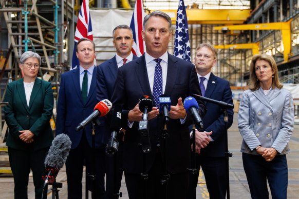 Defence Minister Richard Marles (centre) with (left to right) Foreign Minister Penny Wong, UK Foreign Secretary David  Cameron, South Australian Premier Peter Malinauskas and UK Secretary of State for Defence Grant Shapps.