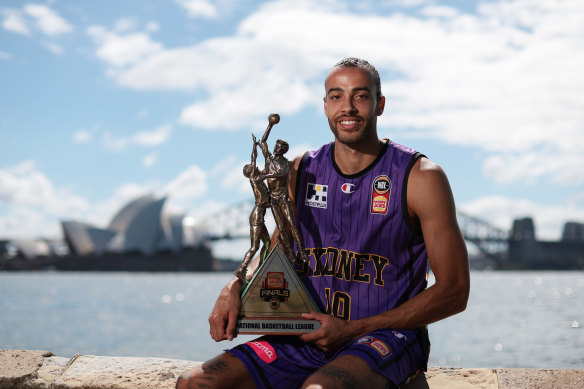 Xavier Cooks with the NBL Championship trophy.