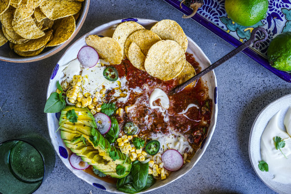 Taco soup with all the toppings.