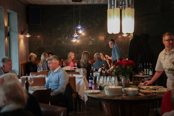 Roma’s dining room features a central table laden with antipasti.