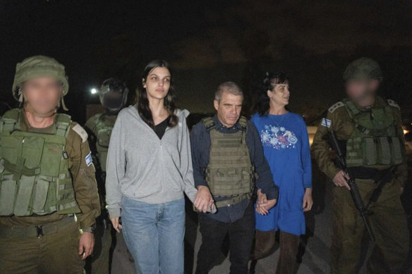 Judith Raanan (right) and her daughter Natalie are escorted by Israeli soldiers as they returned to Israel from captivity in the Gaza Strip.