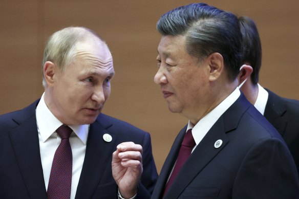 Vladimir Putin speaks to President Xi in Shanghai in September.