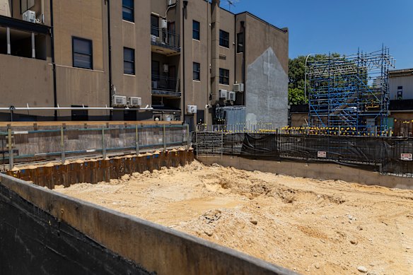The pizza restaurant directly adjoins the construction site.