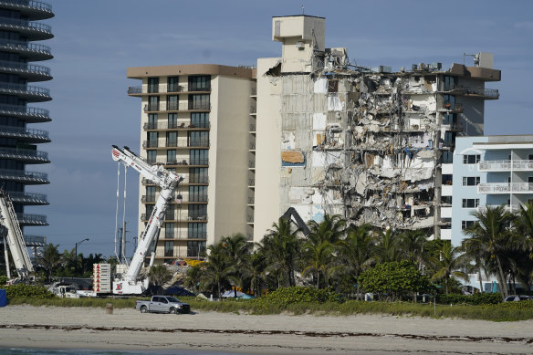 Heavy machinery at the partially collapsed Champlain Towers in Surfside, Florida, earlier on Sunday. 