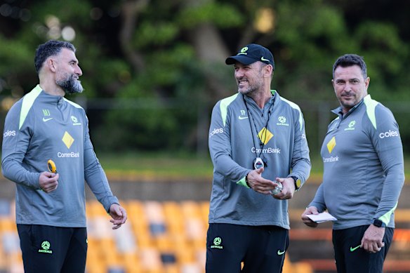 Mile Jedinak with head coach Tony Popovic and fellow assistant Paul Okon.