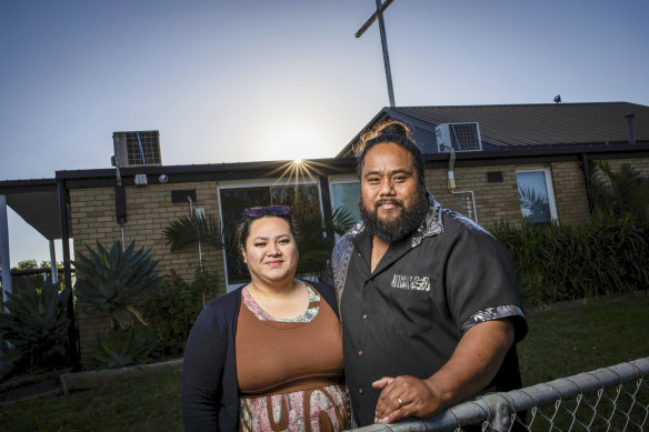 Niuelesolo Boland with his wife Lauina outside the church in Melton. 