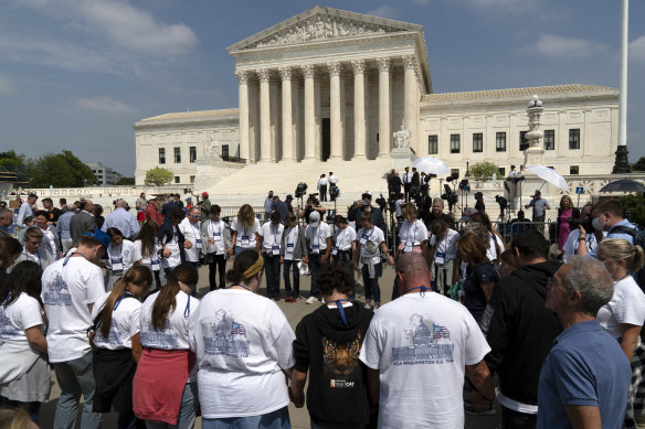 People pray outside of the US Supreme Court.