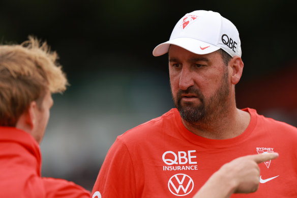 New Swans coach Dean Cox speaks with skipper Callum Mills.