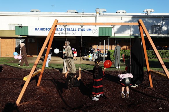 People gather at Bankstown Basketball Stadium for Eid celebrations .