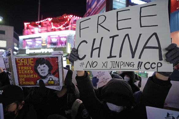 Demonstrators stage a rally to denounce the Chinese government’s continued zero-COVID policy in Seoul, South Korea on Wednesday.