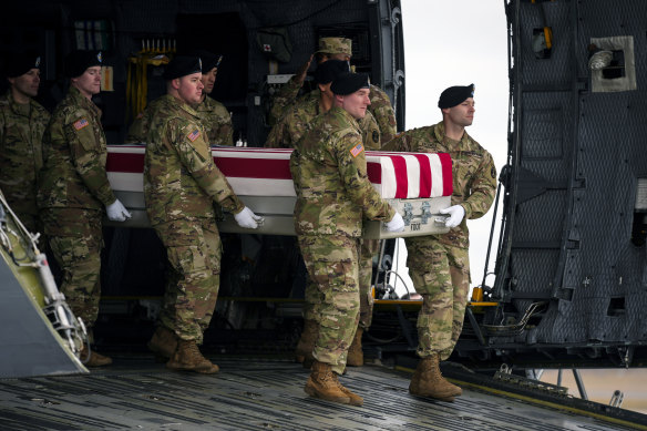 An Army carry team moves the transfer case containing the remains of US Army Sergeant Kennedy Ladon Sanders. Sanders was one of the three US troops killed in the drone attack.